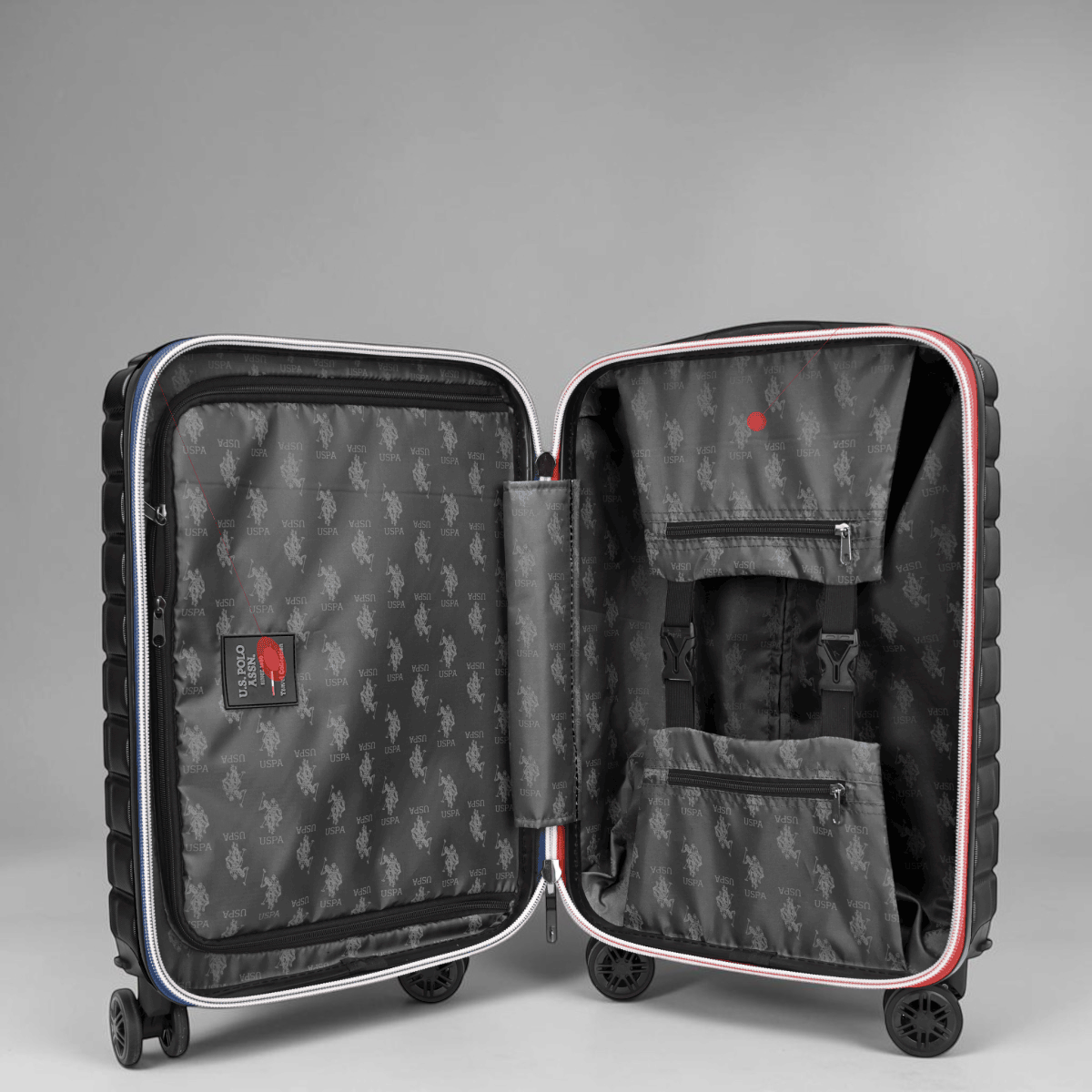 Interior de maleta de viaje www.treshop.com.co U.S. POLO ASSN. negra con forro estampado y compartimentos organizadores