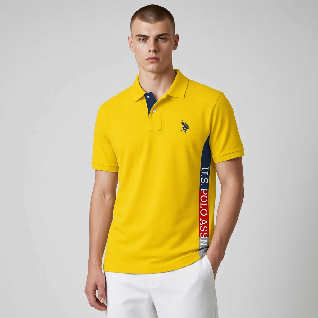 Camisa polo amarilla de algodón U.S. POLO ASSN. de www.treshop.com.co con panel lateral gráfico y logo bordado