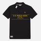 Polo negro de algodón U.S. POLO ASSN. para hombre con estampado gráfico amarillo estilo hawaiano y logo bordado