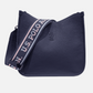 Bolso bandolera www.treshop.com.co azul marino con textura granulada, correa deportiva ajustable y logo grabado.