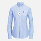 Camisa formal de mujer www.treshop.com.co en color azul claro con cuello estructurado y bordado en el pecho