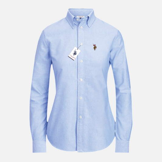 Camisa formal de mujer www.treshop.com.co en color azul claro con cuello estructurado y bordado en el pecho
