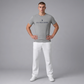 Hombre vistiendo camiseta gris jaspeado de manga corta www.treshop.com.co con logo U.S. POLO ASSN. en el pecho