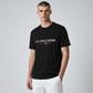 Camiseta negra de algodón para hombre de www.treshop.com.co con logotipo U.S. POLO ASSN. estampado en el pecho