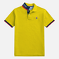 Polo amarillo www.treshop.com.co con cuello estampado, detalles en azul y rojo y logo bordado en el pecho.