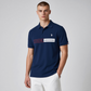 Hombre vistiendo polo azul marino de www.treshop.com.co con logo U.S. POLO ASSN. y estampado American Heritage