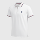 Polo blanco para hombre www.treshop.com.co con cierre de cremallera, detalles en azul y rojo y logo bordado en el pecho