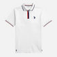 Polo blanco para hombre de www.treshop.com.co con cremallera, cuello y mangas con ribetes tricolores y logo bordado