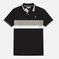 Polo www.treshop.com.co de manga corta con bloques de color negro, gris y blanco y logotipo bordado en el pecho, marca U.S. Polo Assn.