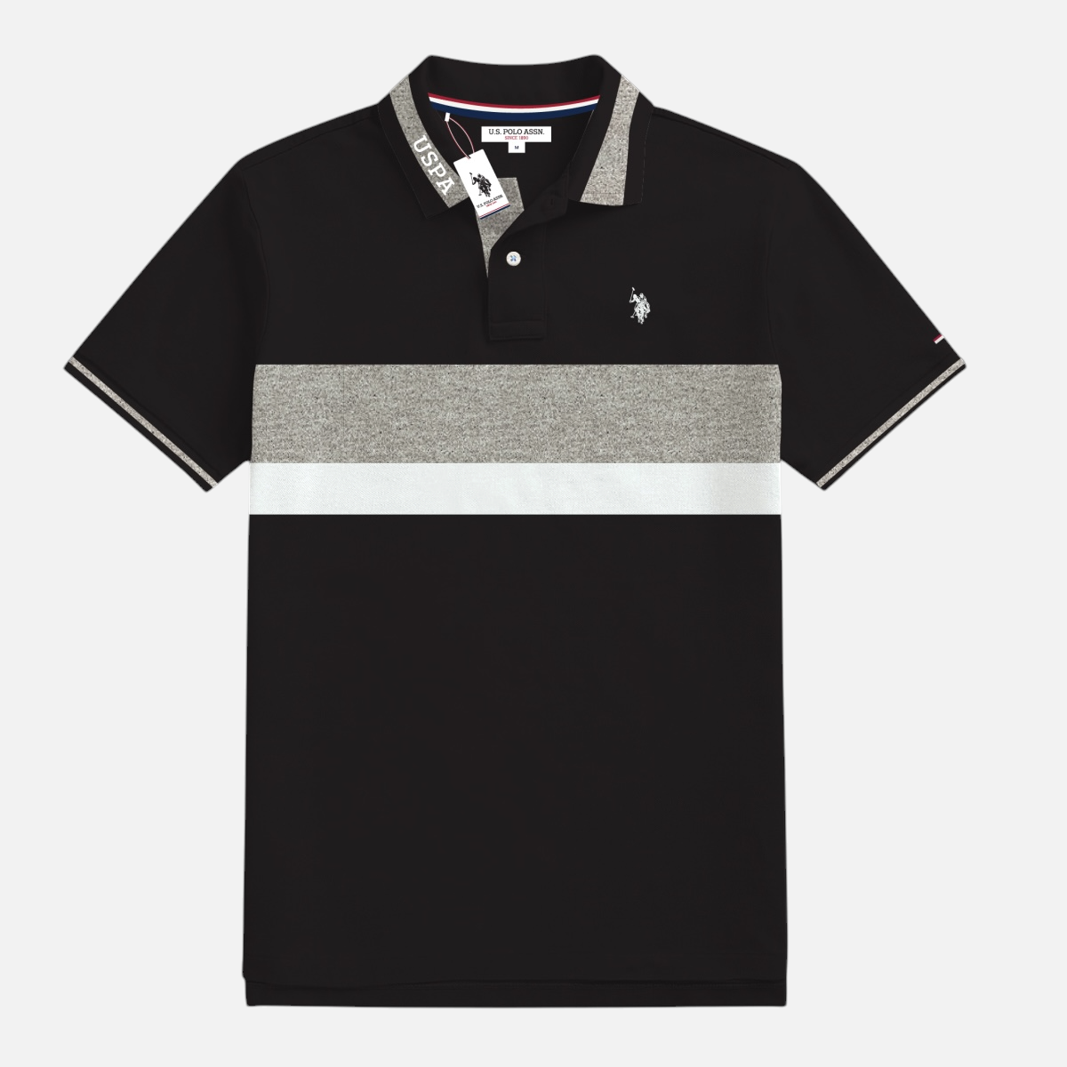 Polo www.treshop.com.co de manga corta con bloques de color negro, gris y blanco y logotipo bordado en el pecho, marca U.S. Polo Assn.
