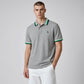 Polo gris de algodón piqué www.treshop.com.co con cuello y mangas de rayas verdes y azules y logo de goma