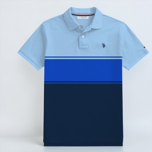 Polo www.treshop.com.co de algodón piqué con diseño de bloques de color azul, corte regular y logo bordado en el pecho