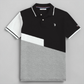 Polo www.treshop.com.co de algodón piqué con diseño color block en negro, blanco y gris y logo bordado en el pecho